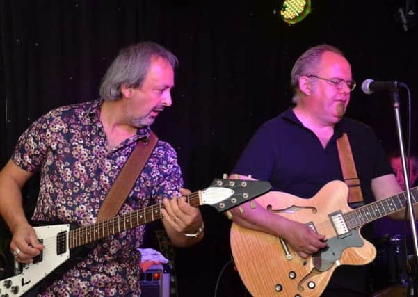 Takis Koutsoumanis on the Flying V and Richard Winfield on lead vocal and guitar with RG Winfield Blues Band