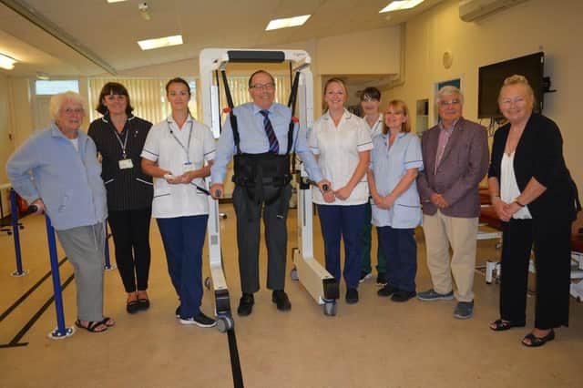 NHS staff and League of Friends of Bexhill Hospital members with the Andago hoist. SUS-181206-153133001