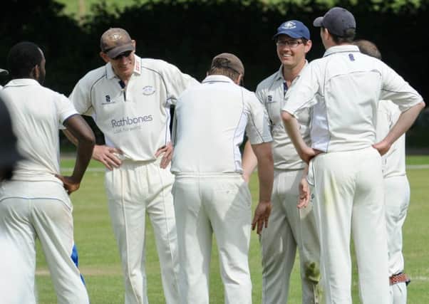 Slinfold all smiles in the field after taking a Findon wicket. Picture by Stephen Goodger