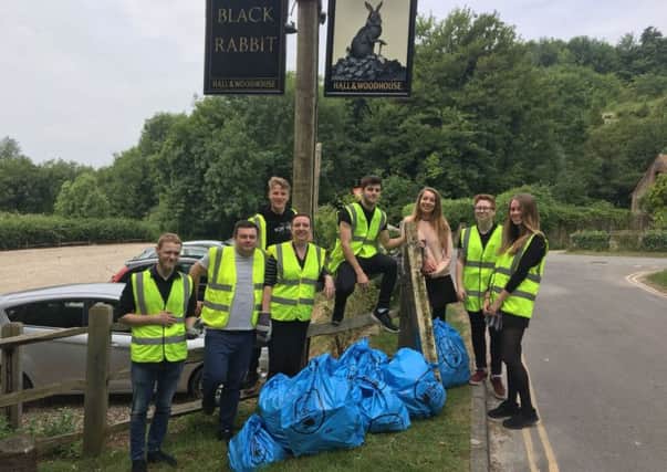 A group of litter pickers from Hall and Woodhouse pubs took part in the Founders Sweepers litter campaign. Pictured outside the Black Rabbit in Arundel SUS-180615-173259001