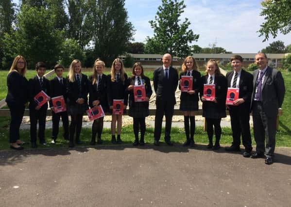 Nick Gibb with pupils from The Regis School , who are participating in The Scholars Programme, along with their teachers