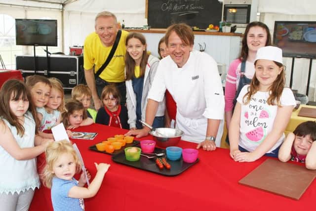 DM1862375a.jpg. Tangmere Airfield Nurseries Open Farm Sunday. Childrens cookery class with chef Jethro Carr and Mark Knight, (technical manager). Photo by Derek Martin Photography. SUS-181006-144210008