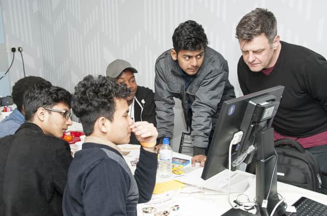 A group of Pestalozzi student working with VR professional Jim Byford at a previous Creative CafÃ©
