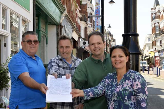 Traders John Worsencroft, Robert Duncombe, Ian Lucas and Chantal Paskins with their petition in Seaside Road, Eastbourne (Photo by Jon Rigby)