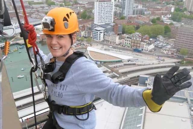 Vicki in her gear beginning the abseil down the tower