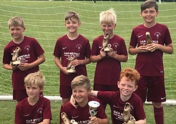 The Little Common team which won the Under-9 Cup at the football club's annual tournament.