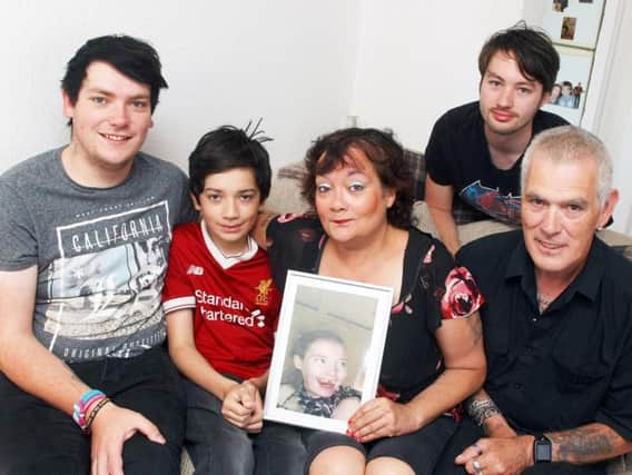 Fiona Presley with her husband Elvis and sons Sheldon, aged 23; Cody, aged 13 and Luke, aged 26