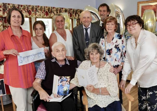 Sally and Michael Tanner with family and friends at their diamond wedding party