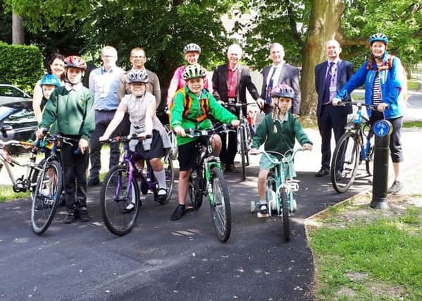 Children and staff from Milton Mount Primary School, with Peter Smith, Clem Smith, plus Stephen Hillier, Roland Plumb,  Thomas Collins, and Marie Ovenden