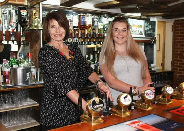 DM1862910a.jpg.  White Horse pub at Rogate reopens after huge campaign. Licence holder Wendy Humphreys and Aby Carter. Photo by Derek Martin Photography. SUS-180614-184528008