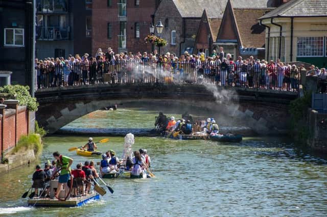 A raft race from the past. This year's spectacular event takes place on Sunday, July 1. Photograph by James McCauley