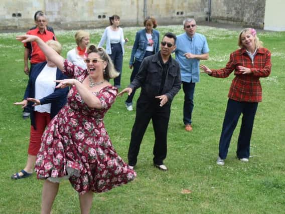 Dawn Gracie leads the dancing on the Cathedral Green