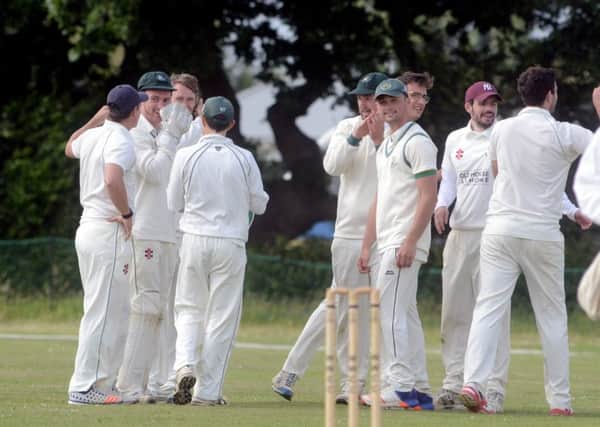 West Wittering celebrate a wicket against Wisborough Green