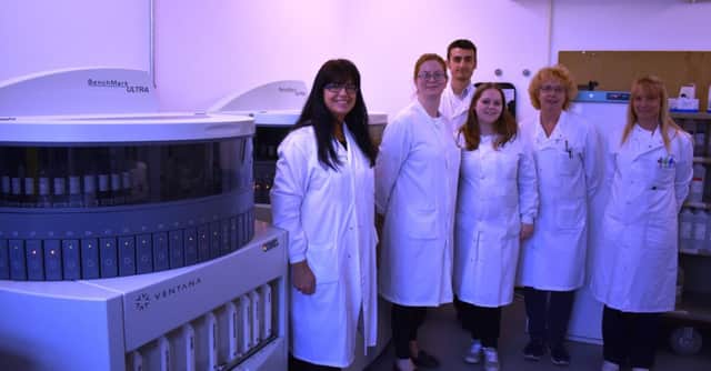 Pathology staff at the Conquest with some of their new pathology equipment SUS-180618-135705001
