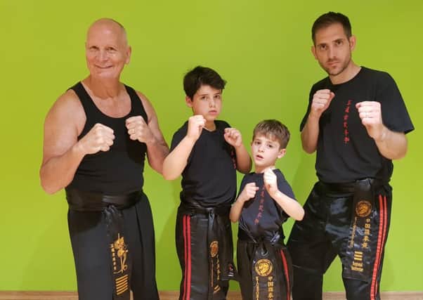 The young black belts with their coaches