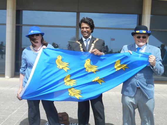 The Sussex Day flag is unfurled. Picture by Margaret Garcia SUS-180619-120550001