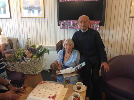 Ivy Galpin celebrating her 105th birthday with her son Derek