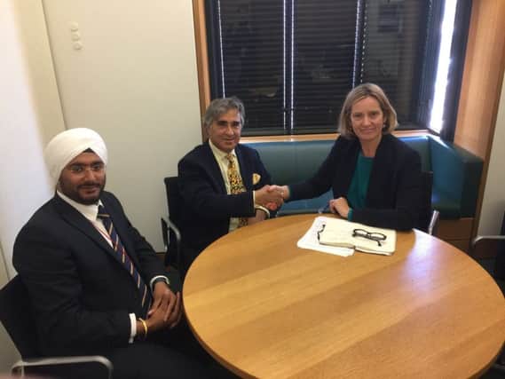 Amber Rudd with  Abid Gulzar, the new owner of Hastings Pier, and Manasdeep Singh. SUS-180619-143923001