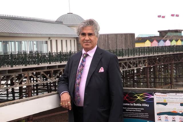 Sheikh Abid Gulzar pictured with Hastings Pier