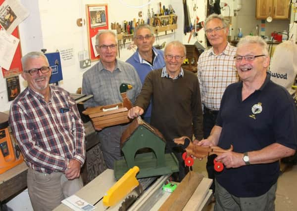 Roy Amos, left, with members of the Littlehampton Lads in their workshop in Rope Walk. Picture: Derek Martin