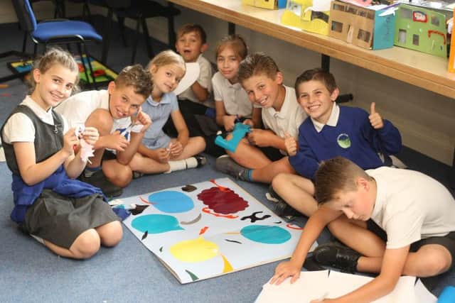Steyning Primary School pupil cutting out shapes for their artwork. Picture: Derek Martin DM1864636a