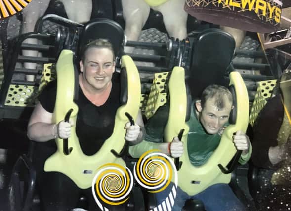 Senior support worker Aimee White and Sam Motton on the trip to Alton Towers