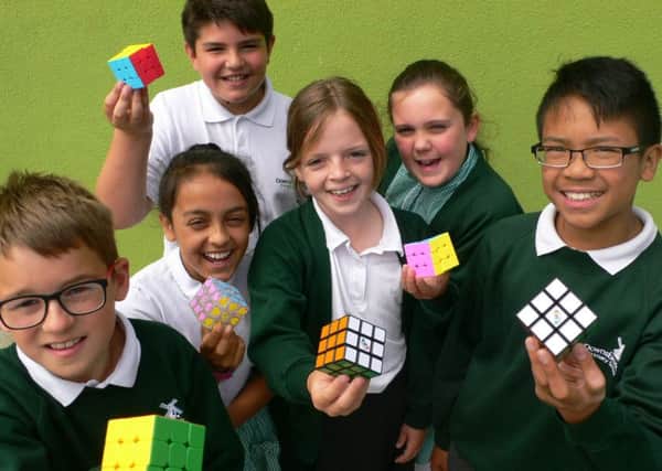 Pupils from Downsbrook Primary School, Worthing, took part in a Rubik's Cube challenge
