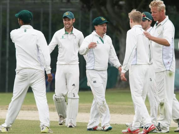 West Chiltington celebrate the wicket of Ollie Collins