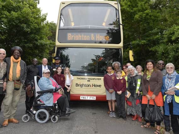 The Thomas Highflyer bus with Brighton & Hove Black History Group, Brighton and Hove Buses managing director Martin Harris and children from St Mark's C of E Primary School