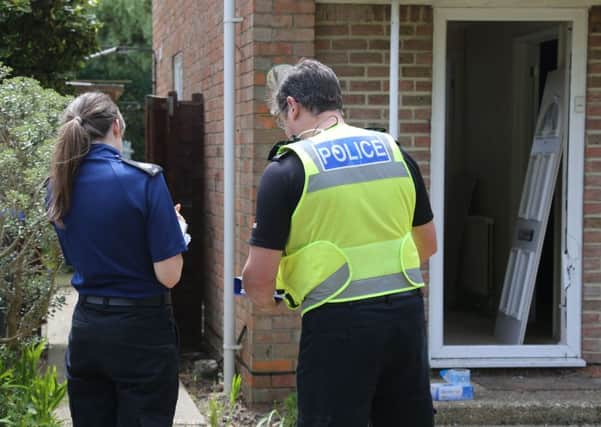 Police in discussions outside the house in Limbrick Lane, Goring SUS-180620-175940001