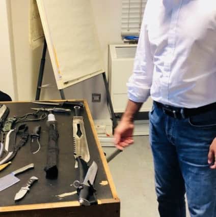 Home Secretary Sajid Javid being shown examples of street knives. Picture: Home Office