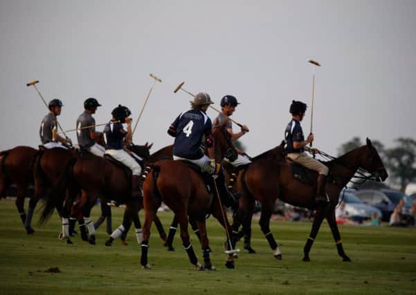 Sunset polo at Cowdray Park staged by Nic Roldan and photographed by Clive Bennett