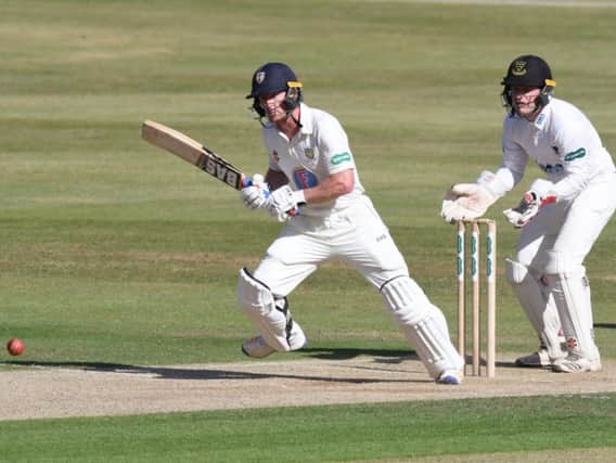 Ben Brown keeps an eye on things behind the stumps as Durham struggle / Picture by Neil Marshall
