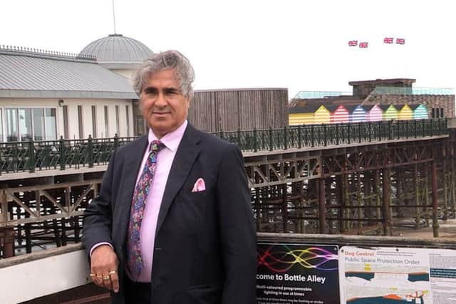 Sheikh Abid Gulzar pictured with Hastings Pier