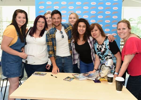 Peter Andre promotes his new Thomas and Friends film at Smyths Toy Superstore in Crawley.  Pictured is Peter with fans from London.   Picture : Liz Pearce 23/06/2018