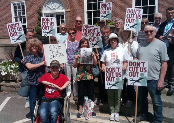 Families of users of Chichester's Wrenford day  centre for adults with learning disabilities and campaigners from Don't Cut Us Out, outside County Hall on Friday June 22