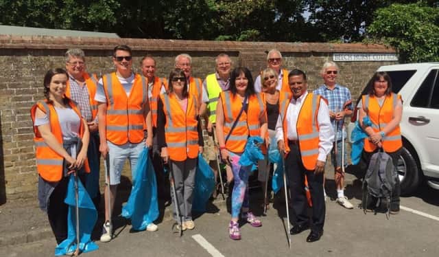 Councillors and residents joined forces on Saturday to clean up Beech Hurst Gardens in Haywards Heath