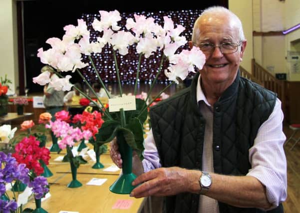 Alasdair MacCulloch with his vase of sweet peas, which won him the Dave Sanders Memorial Cup and the National Sweet Pea Society Bronze Medal