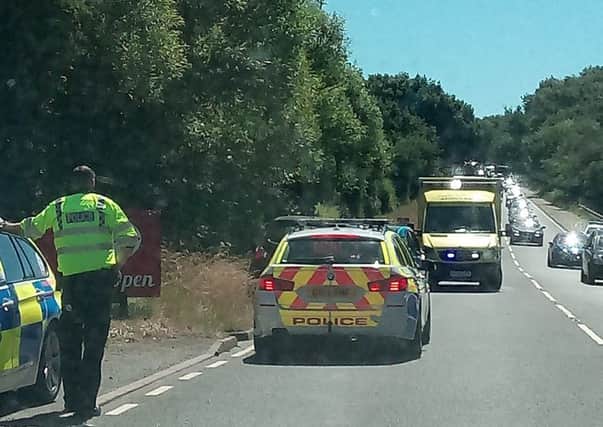 The road has been partially blocked following a road traffic collision