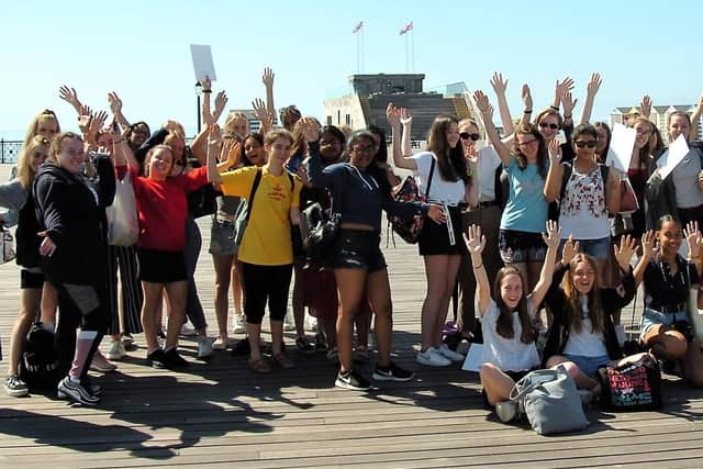 Students gather on Hastings Pier as it reopened to the public. Pictures: Sid Saunders and Sarah Lawlor