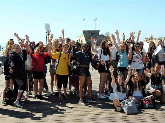 Students gather on Hastings Pier as it reopened to the public. Pictures: Sid Saunders and Sarah Lawlor