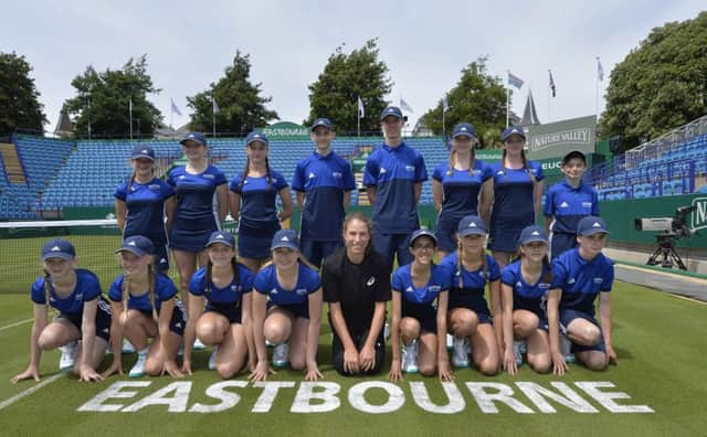 Tennis star Joanna Konta lines up with ball boys and girls from Cavendish and Moira House School today at the Nature Valley International Tournament at Devonshire Park in Eastbourne (Photo by Jon Rigby) SUS-180626-123921002