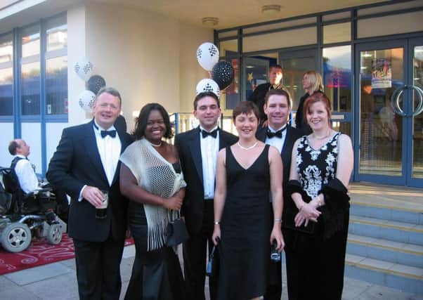 Della Ferrari with friends attending a charity ball at Martlets Hall in 2005