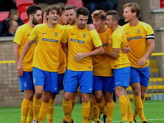 Lancing celebrate a goal last season. Picture by Stephen Goodger