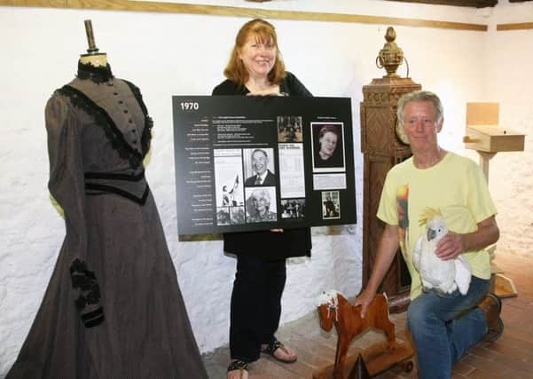 Amanda Evans and Peter Joyce settting up for the Wick Theatre Company heritage exhibition. Photo by Derek Martin DM1865416a