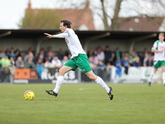 Gary Charman charges forward for the Rocks / Picture by Tim Hale
