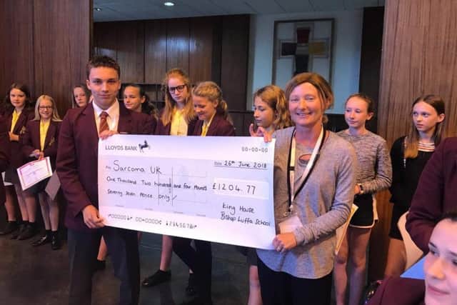 Bishop Luffa School King House raised more than Â£1,200 in a Triathlon event over six weeks. They ran swan and cycled a distance equivalent to Chichester to Mont Blanc, and presented Mel with a cheque in assembly