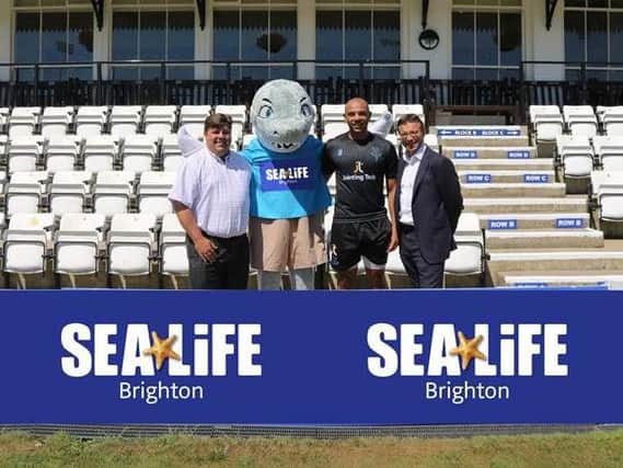 Max Leviston, SEA LIFE Brighton general manager pictured with (from l-r) Sharky, Sussex Sharks paceman Tymal Mills and Sussex Cricket chief executive, Rob Andrew. Picture courtesy of Sussex Cricket