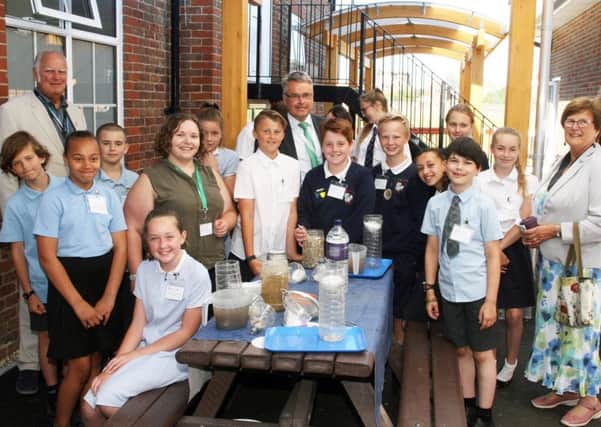 Tim Loughton with children at the eco summit at Worthing High School. The Water Filtering workshop. Photo by Derek Martin Photography  DM1865272a
