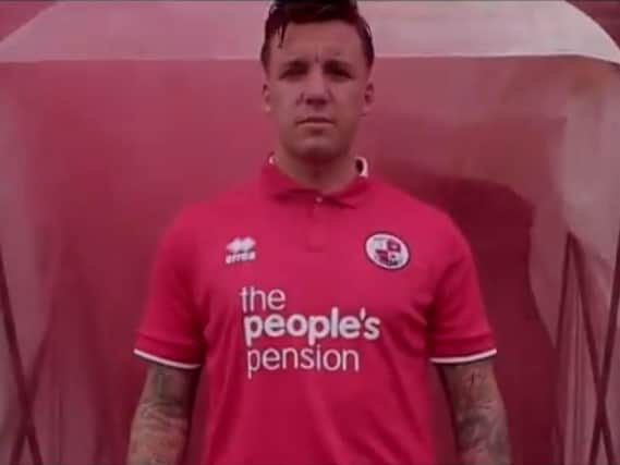 Jimmy Smith models the new kit for the promotional video on the club's website